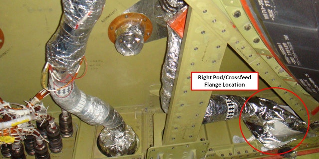 This photo released by NASA shows the connecting point in a fuel line, labeled and circled by NASA, which had been leaking on space shuttle Discovery's right-side orbiter maneuvering system engine.