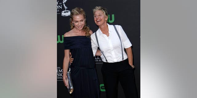 ** CORRECTS TO ROSSI **Ellen DeGeneres, right, and Portia de Rossi arrive at the Daytime Emmy Awards on Sunday Aug. 30, 2009, in Los Angeles. (AP Photo/Matt Sayles)
