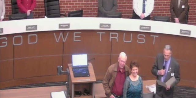 The display of "In God We Trust" motto on the Wentzville council podium sparked protests from anti-religion groups.