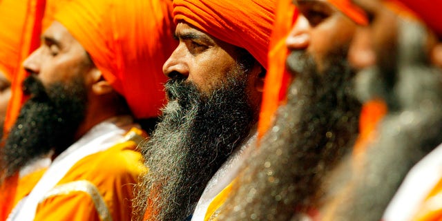 Sikh men march down Broadway during the annual Sikh Day parade in New
York, April 19, 2003. The Sikh religion has a following of over 20
million people worldwide and is ranked as the worlds 5th largest
religion. REUTERS/Shannon Stapleton
SS/HB - RTRM3CF