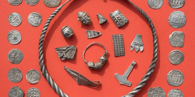 Jewelry and coins found near Schaprode on the northern German island of Ruegen in the Baltic Sea. (Stefan Sauer/dpa via AP)