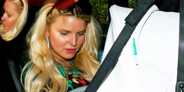 Jessica Simpson takes baby Maxwell to her 32nd birthday party at the Beverly Hills Hilton on July 10, 2012.