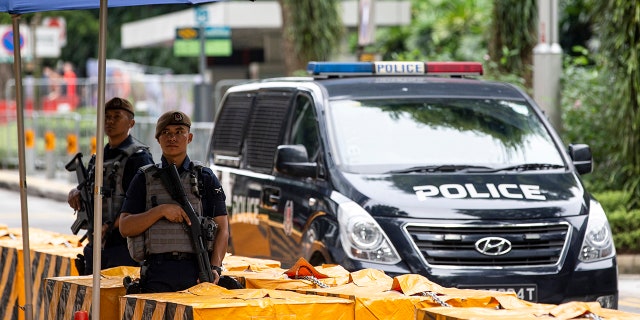 Gurkha police officers stand guard outside the St. Regis Hotel in Singapore ahead of the June 12 summit between U.S. President Donald Trump and North Korean leader Kim Jong Un, June 10, 2018.