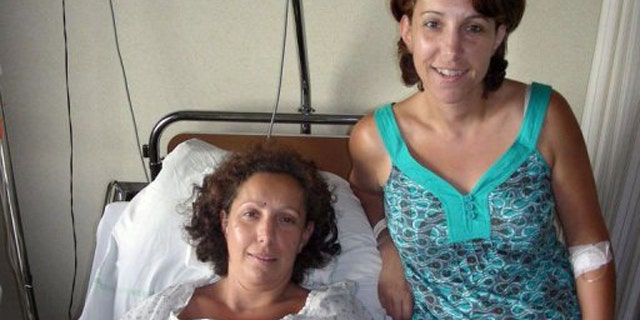 Karine Thiriot (L) and her twin sister Stephanie.