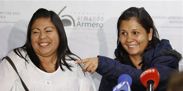 Feb. 25, 2016: Jacqueline Vasquez Sanchez, left, and her sister Lorena Sanchez, right, smile during a press conference in Bogota, Colombia.