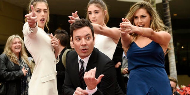 Jimmy Fallon, host of the 74th Annual Golden Globe Awards, poses with Miss Golden Globes 2017, from left, sisters Sistine, Scarlet and Sophia Stallone after rolling out the red carpet during Golden Globe Awards Preview Day at the Beverly Hilton on Wednesday, Jan. 4, 2017, in Beverly Hills, Calif. The awards will be held on Sunday. (Photo by Chris Pizzello/Invision/AP)