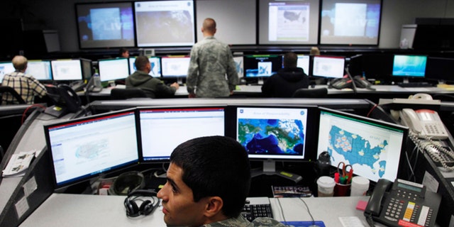 July 20, 2010: Lt William Liggett works at the Air Force Space Command Network Operations & Security Center at Peterson Air Force Base in Colorado Springs, Colorado.