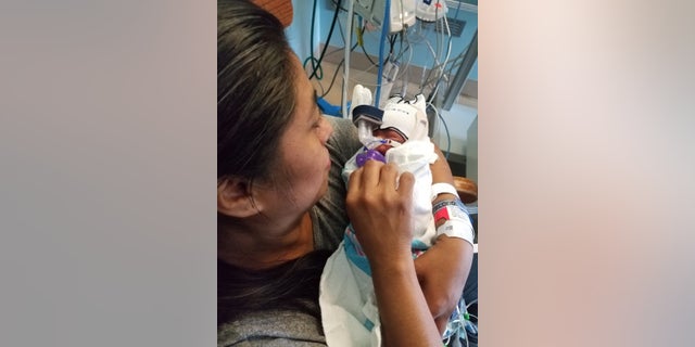 Six Flags Over Georgia gave a mother and her newborn son free lifetime passes after she gave birth in the theme park on Monday.
