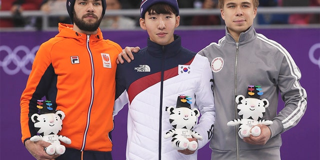 Feb. 10, 2018: Lim Hyojun, center, of South Korea stands on a podium during a Venue Ceremony following his win in the men's 1500 meters short-track speedskating final in the Gangneung Ice Arena at the 2018 Winter Olympics.