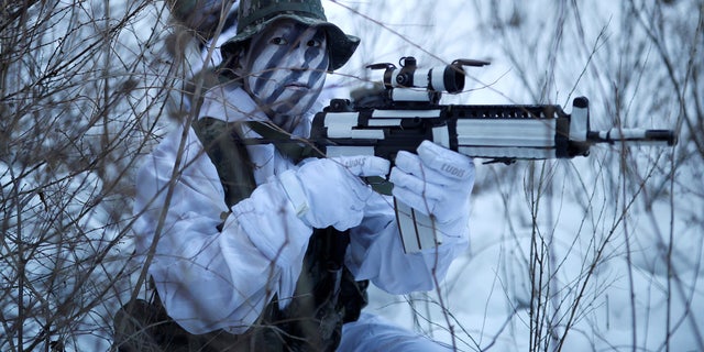 South Korean and U.S. Marines take part in a winter military drill in Pyeongchang, South Korea on Dec. 19.