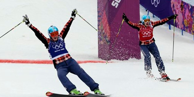 Feb. 21, 2014: Canada's Marielle Thompson, left, celebrates winning the gold medal ahead of compatriot Kelsey Serwa right, in the women's ski cross final at the Rosa Khutor Extreme Park, at the 2014 Winter Olympics.