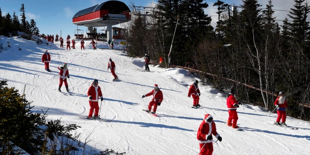 Skiers dressed as Santa Claus ski en masse in Maine.
