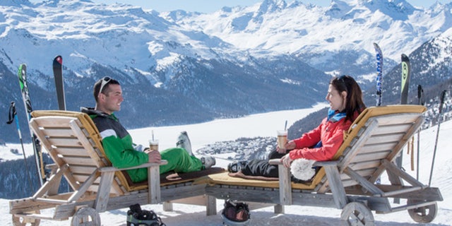 Winter tourism in the Swiss Alps means catch rays after a day of skiing.