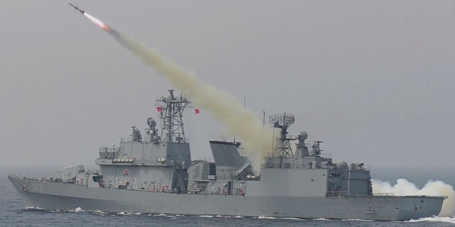 A South Korean navy ship fires a missile during a drill in South Korea's East Sea Thursday.