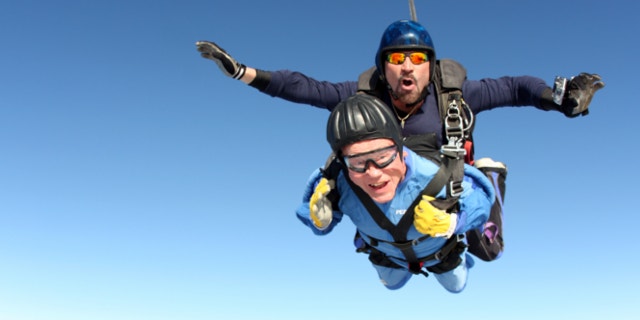 Nov. 4, 2013: In this photo provided by Skydive Perris/U.S. Parachute Association, Vernon Maynard, bottom, skydives with instuctor James Perez to celebrate his 100th birthday over Perris, Calif.