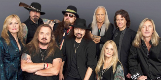 Members of the most recent lineup of Lynyrd Skynyrd, including lead singer Johnny Van Zant (front, second from left) and guitarist Gary Rossington (center).