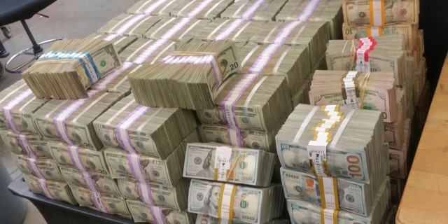 This undated photo provided by U.S. Customs and Border Protection shows cash seized by the U.S. Border Patrol who says it's seized more than $3 million that was being smuggled from the U.S. into Mexico.