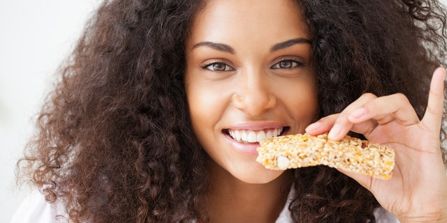 Young woman about to eat a healthy snack.