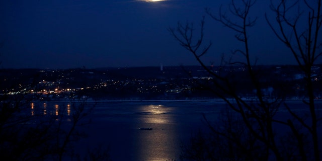 The full "Snow" moon rises above the Hudson River and the town of Irvington in Westchester County New York as seen from the west side of the Hudson in the town of Orangeburg in Rockland County, New York February 3, 2015. "Snow" moon is a traditional name for the full moon that occurs in the winter month of February in North America. (REUTERS/Mike Segar)