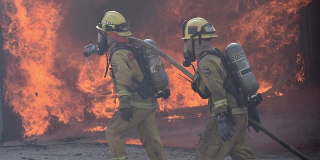 Firefighters respond to wildfires in Southern California.