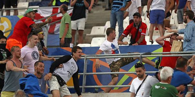 Russian supporters attack England fans at the end of the Euro 2016 Group B soccer match between England and Russia, at the Velodrome stadium in Marseille, France, Saturday, June 11, 2016. (AP Photo/Thanassis Stavrakis)