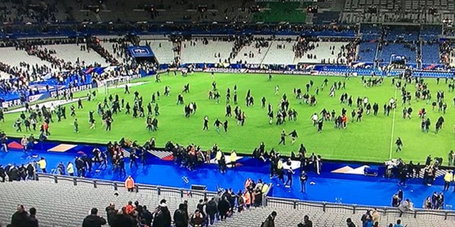 The soccer stadium where a match between France and Germany was going on as the attack began is shown.