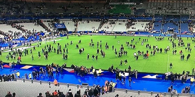 The soccer stadium where a match between France and Germany was going on as the attack began is shown.