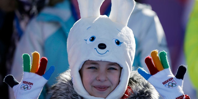 Feb. 6, 2014: A girl wears a hat in the shape of the Sochi Winter Olympics mascot while watching the men's snowboard slopestyle qualifying at the Rosa Khutor Extreme Park ahead of the 2014 Winter Olympics in Krasnaya Polyana, Russia.