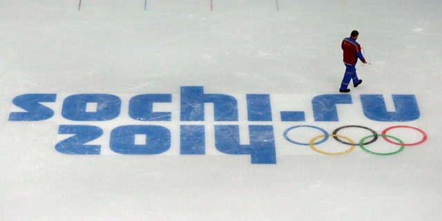 Jan. 25, 2014: A worker leaves after checking ice conditions at the Iceberg Skating Palace, where the figure skating and short track speed skiing will take place, at the 2014 Winter Olympics in Sochi, Russia. The Olympics begin Feb. 7th.