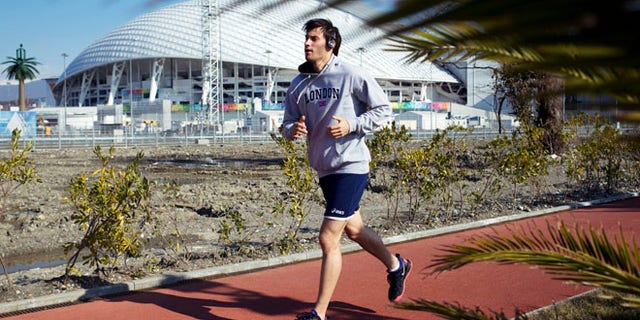 Feb. 10, 2014: A man runs at a boardwalk near the Fisht Olympic Stadium in Olympic Park during the 2014 Winter Olympics in Sochi, Russia.