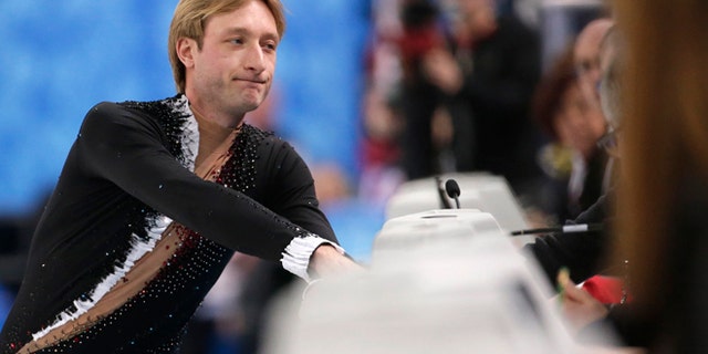 Feb. 13, 2014: Evgeni Plushenko of Russia speaks with an official prior to pulling out of the men's short program figure skating competition due to illness at the Iceberg Skating Palace during the 2014 Winter Olympics in Sochi, Russia.