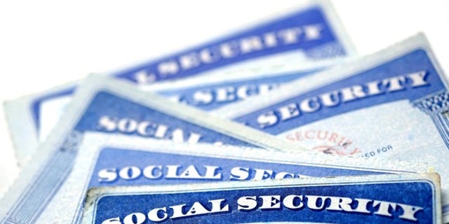 FILE - Social security cards