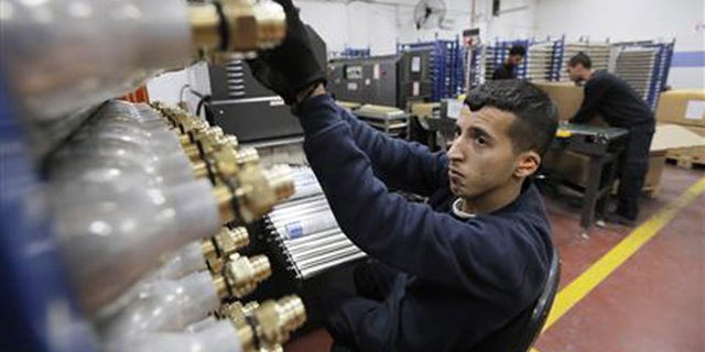 Palestinian employee works at the SodaStream factory in the West Bank Jewish settlement of Maale Adumim Jan. 28, 2014. (Reuters)