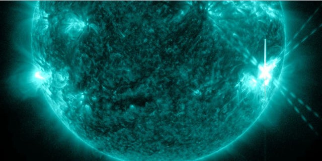 An X1.1-class solar flare (lower right) erupts from the sun on July 6, 2012, in this image from NASA's Solar Dynamics Observatory.