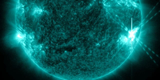 An X1.1-class solar flare (lower right) erupts from the sun on July 6, 2012, in this image from NASA's Solar Dynamics Observatory.