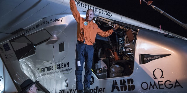 In this photo provided by Solar Impulse, Bertrand Piccard acknowledges the crowd prior to the takeoff of "Solar Impulse 2," in Goodyear, Ariz., Thursday, May 12, 2016. The solar-powered airplane that landed in Arizona last week is headed to Oklahoma on the latest leg of its around-the-world journey. (Jean Revillard/Solar Impulse via AP)