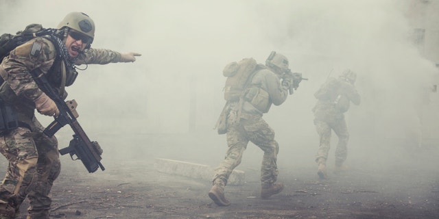 United States Army rangers during the military operation in the smoke and fire