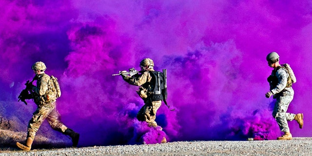 Jan. 14, 2012: Paratroopers run through a smokescreen during a live-fire exercise at the Joint Readiness Training Center, Fort Polk, La. Hight-tech undergarments will let the Army monitor warfighters of the future -- alerting a command center to the exact status of men on the ground.
