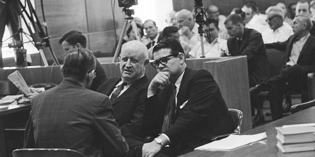 Sept. 25, 1962: In this file photo, Billie Sol Estes, right, confers with his attorneys, John Cofer, center, and John Dennison during recess in trial in Tyler, Texas
