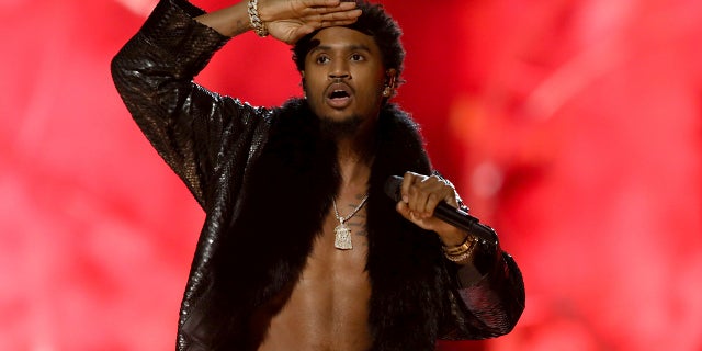 Singer Trey Songz, who is accused of felony domestic violence, turned himself in to Los Angeles police on Monday.