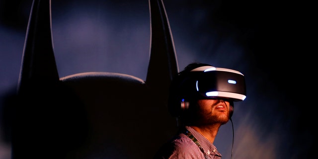 People try the new Sony VR headset during Sony Corporation's PlayStation 4 E3 2016 event in Los Angeles, California, U.S. June 13, 2016. (REUTERS/Mike Blake)