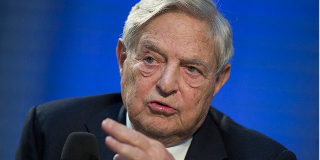 Soros Fund Management Chairman George Soros speaks during a panel discussion at the Nicolas Berggruen Conference in Berlin, October 30, 2012. REUTERS/Thomas Peter (GERMANY - Tags: POLITICS BUSINESS HEADSHOT) - RTR39RO6