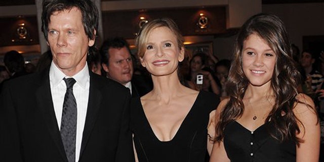 FILE - In this May 9, 2009 file photo, actors Kevin Bacon, left, and Kyra Sedgwick, center, pose with their daughter Sosie Bacon at the 2009 White House Correspondents' Association Dinner at the Washington Hilton, in Washington. The Hollywood Foreign Press Association has selected the actress Sosie Bacon as Miss Golden Globe 2014 for the 71st Annual Golden Globe Awards. It was announced by the HFPA Thursday, Nov. 21, 2013, at an event held at Fig and Olive in West Hollywood, Calif. (AP Photo/Evan Agostini)