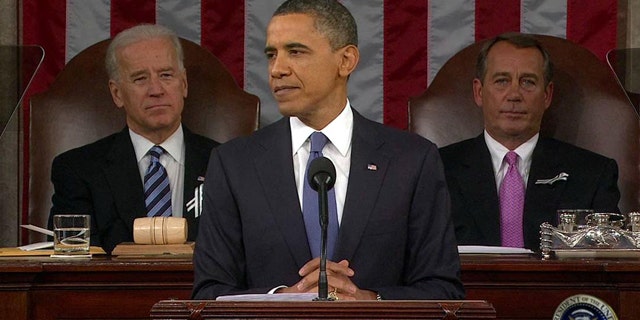Jan. 25: President Obama addresses Congress during his State of the Union Address as Vice President Joe Biden and House Speaker John Boehner listen.
