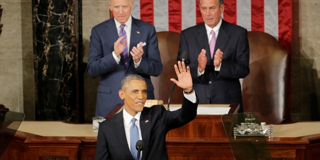 Jan. 20, 2015: President Barack Obama waves before giving his State of the Union address before a joint session of Congress on Capitol Hill in Washington. (AP)