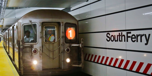 The No. 1 train pulls into the South Ferry Station, Tuesday June 27, 2017, in New York. The station reopened Tuesday, nearly five years after it was flooded by Superstorm Sandy in October 2012. (AP Photo/Bebeto Matthews)