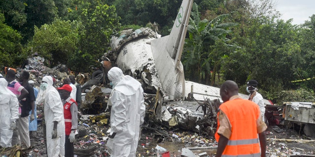 Nov. 4, 2015: Responders pick through the wreckage of a cargo plane which crashed in the capital Juba, South Sudan. The cargo plane was taking off from the South Sudanese capital of Juba when it crashed along the banks of the Nile River, killing dozens according to witnesses and the government.