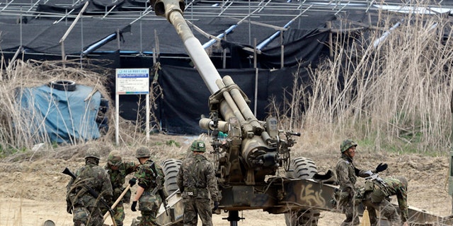 April 18, 2013: South Korean soldiers prepare 155 mm howitzers during their military exercise in the border city between two Koreas, Paju, north of Seoul, South Korea. North Korea on Thursday demanded the withdrawal of U.N. sanctions and the end of U.S.-South Korea military drills as conditions for resuming talks meant to defuse tension on the Korean Peninsula.