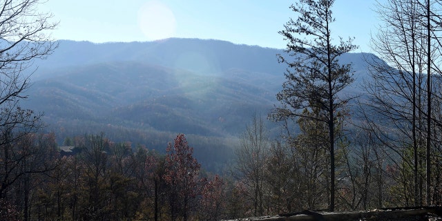 The charred foundation is all that remains of a home in the Cobbly Knob area of Pigeon Forge, Tenn., on Thursday.