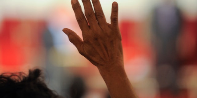 Churchgoers sing during a prayer meeting at Southern Missionary Baptist Church in Los Angeles on Aug. 31, 2011.